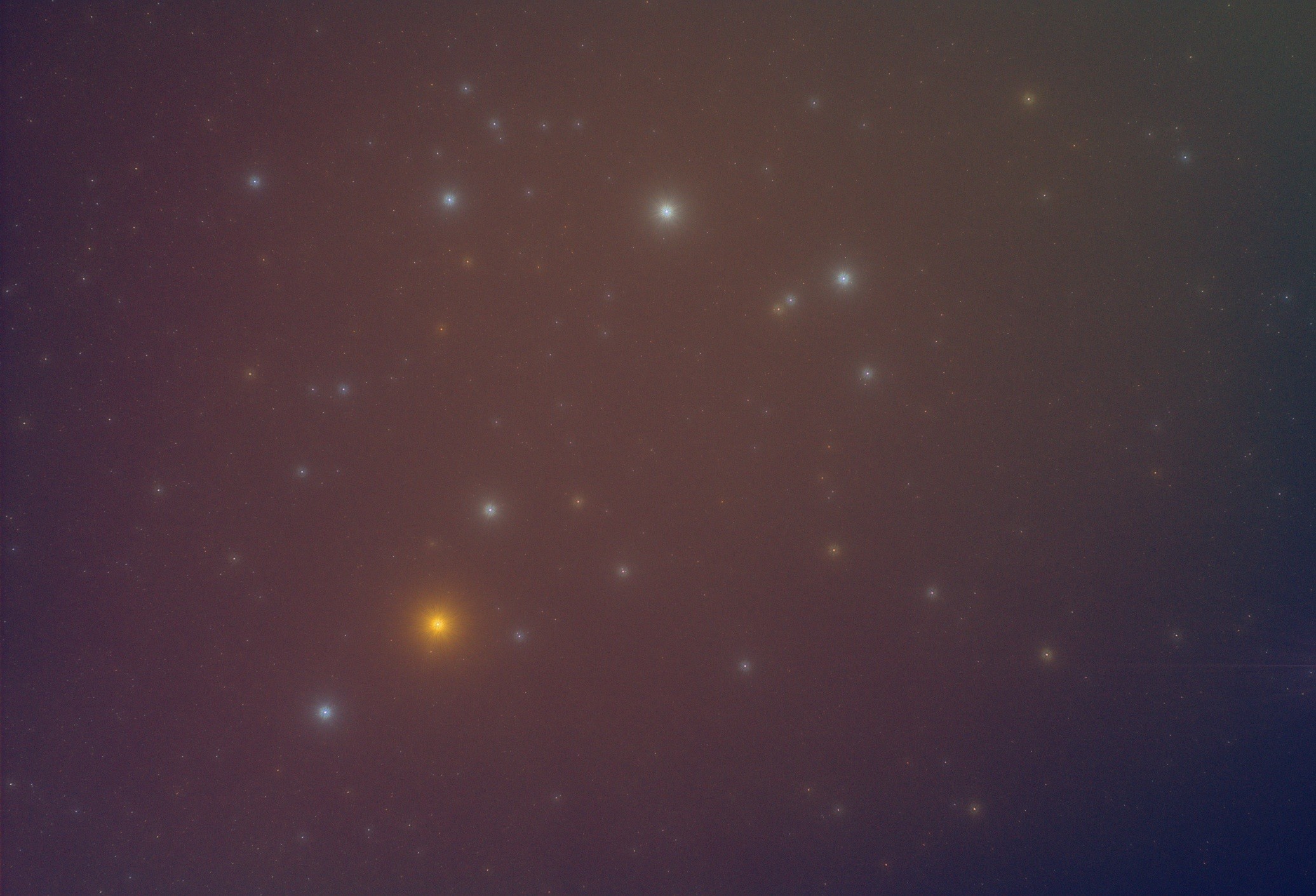 Wide and very blurry view of some bright colourful stars in the heart and claws of Scorpius. There is no fine and faint detail at all.